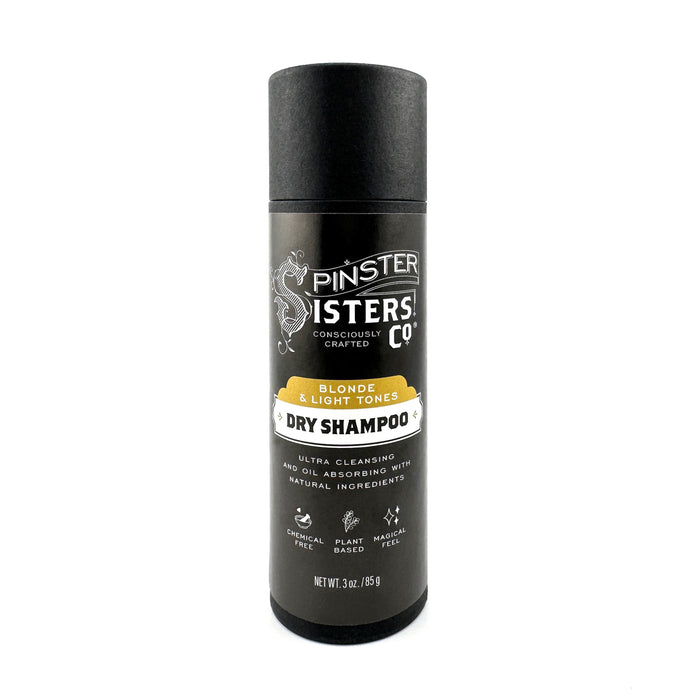Spinster Sisters Co.s Dry Shampoo is a black cylindrical bottle tailored for blonde and light tones. Made with natural, plant-based ingredients, it combines deodorizing baking soda for ultra-cleansing and oil-absorbing properties, making hair freshening effortless.