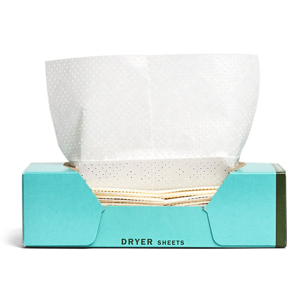 An open box of Mrs. Meyers Dryer Sheets reveals white, dotted-texture sheets for freshness. The package prominently displays DRYER SHEETS in black lettering.