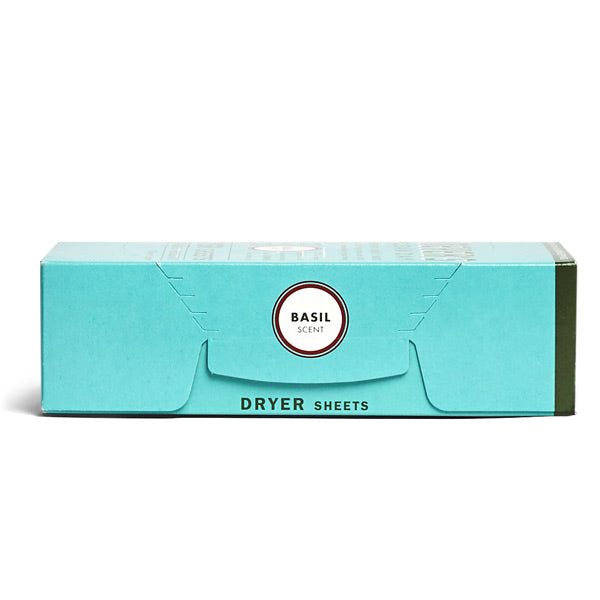 A teal box of Mrs. Meyers Dryer Sheets sits on a white background. The minimalist design highlights the promise of fabric softening and a fresh basil scent with each sheet inside, exuding simplicity and elegance.