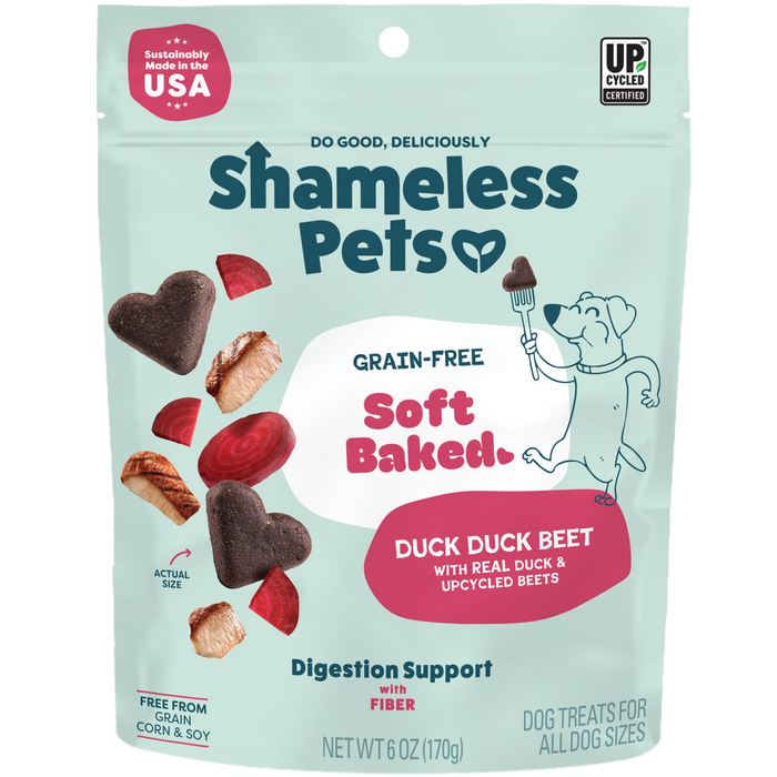 Shameless Pets Duck Duck Beet Soft-Baked Dog Treats come in a teal bag with heart and round-shaped treats, beets, and a cartoon dog holding a fork. These natural treats use upcycled ingredients and support healthy digestion.