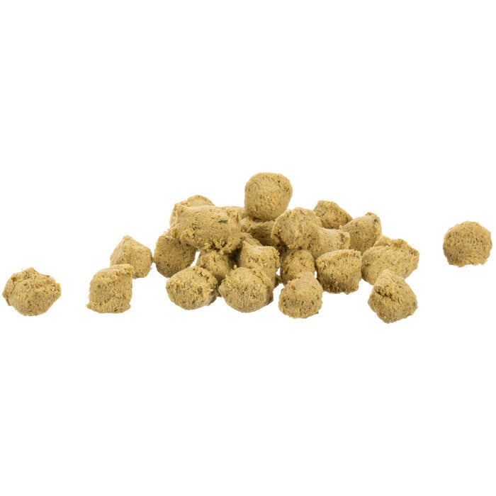 A collection of small, round, tan-colored chunks of West Paws Duck Superfood Freeze-Dried Raw Dog Treats featuring limited ingredients is shown isolated on a white background.