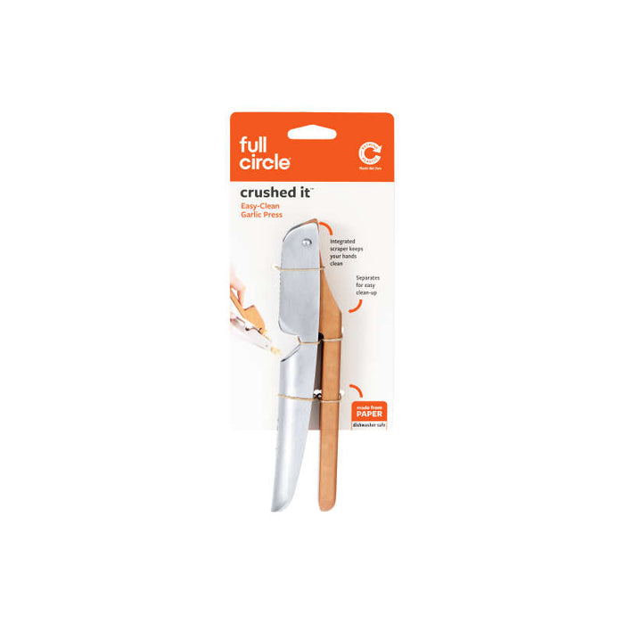 The Full Circle Easy-Clean Garlic Press features a sleek silver crusher, a wooden scraper handle, integrated scraping and cleaning functions, and dishwasher-safe convenience.
