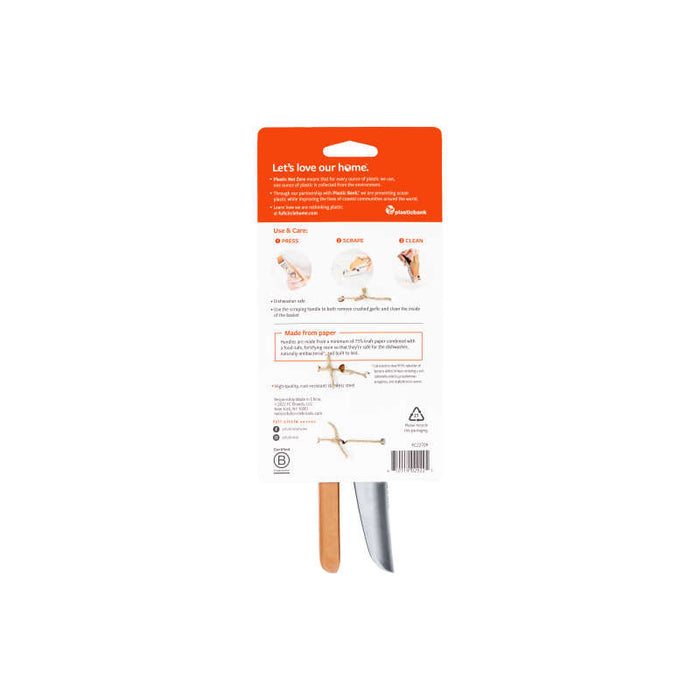 The image shows the back of a Full Circle Easy-Clean Garlic Press package. An orange header reads Lets love our home above illustrated use and care instructions. A handle and blade part are visible at the bottom, and the product is noted as dishwasher safe for easy cleaning.