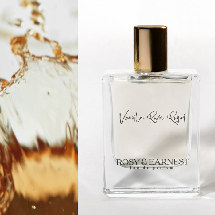 Rosy & Earnests Vanilla Rum Royal eau de parfum features a shiny gold cap and amber liquid on the left, offering gourmand notes. Set against a white backdrop, this cruelty-free scent combines luxury and conscience.