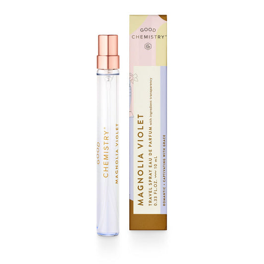 A tall, clear glass bottle of Good Chemistrys Eau De Parfum Travel Spray is shown next to its floral-accented box, which announces the scent as Romantic + Captivating with Grace and emphasizes its vegan and cruelty-free formula.