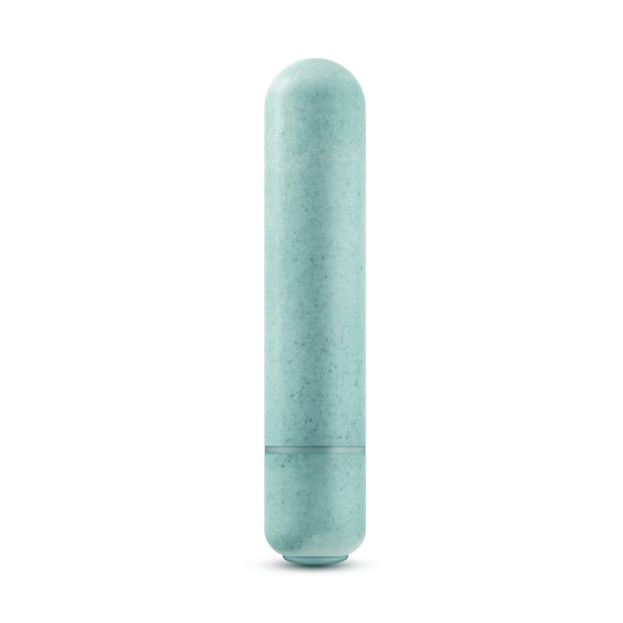 An aqua, vertical cylindrical object, smooth with a seam near the base, slightly resembles a capsule or pillar—likely the Blush Gaia Eco Bullet waterproof vibrator for sustainable pleasure.