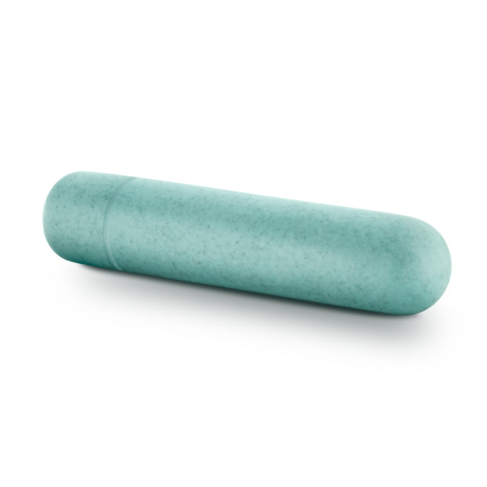A turquoise, cylindrical Blush Gaia Eco Bullet capsule rests on a pure white background.
