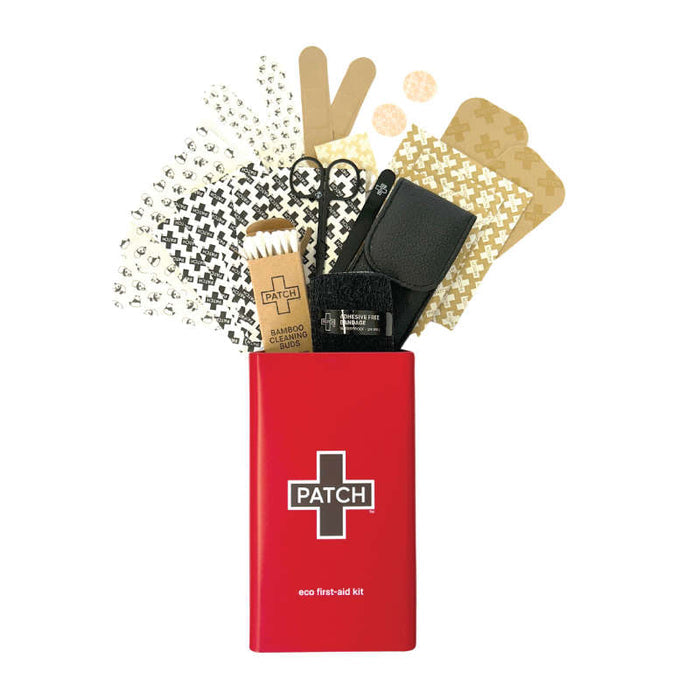 The PATCH Eco First-Aid Kit is a red kit filled with sustainable wound care items, including hypoallergenic bandages with fun patterns, scissors, a reusable cloth, and a bamboo bandage tube—ideal for eco-friendly health solutions.