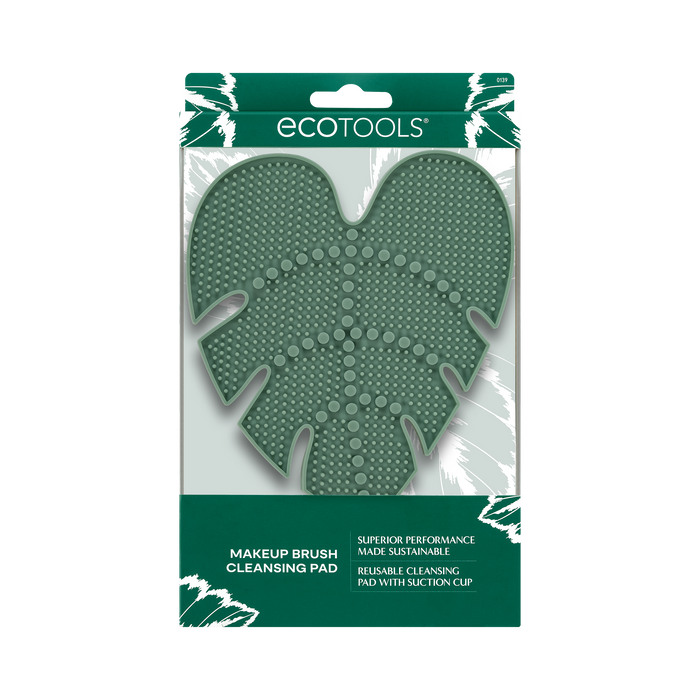 Packaged in a green and white box, the EcoTools Eco Makeup Brush Cleansing Pad boasts various textured surfaces for effective cleaning. Made from cruelty-free materials, this reusable and eco-friendly mat ensures superior performance.