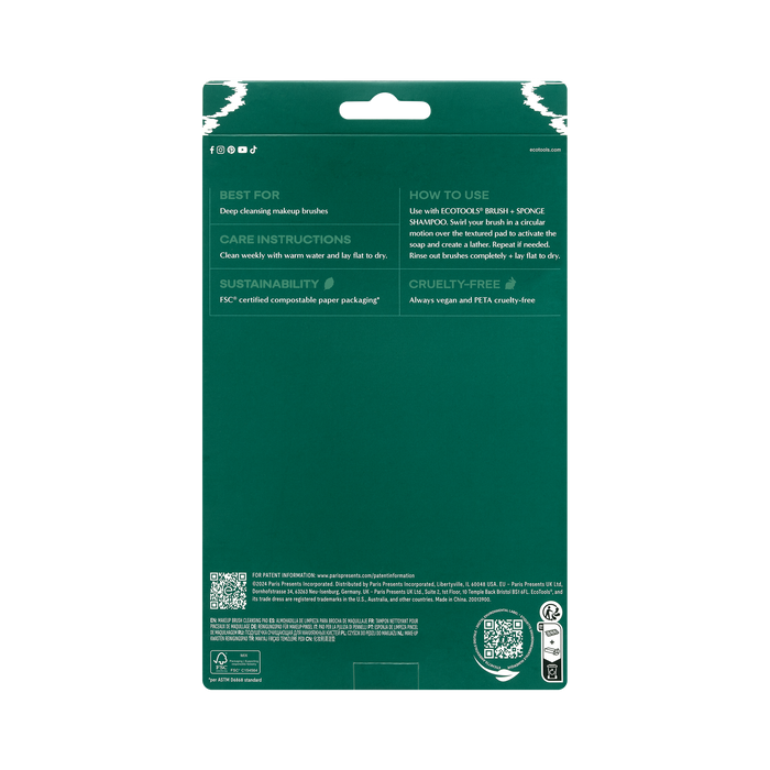 The EcoTools Eco Makeup Brush Cleansing Pad features vibrant green packaging with usage instructions, care tips, and sustainability info. Made from FSC-certified paper, its cruelty-free and vegan. It includes a reusable cleaning mat with convenient QR codes at the bottom.
