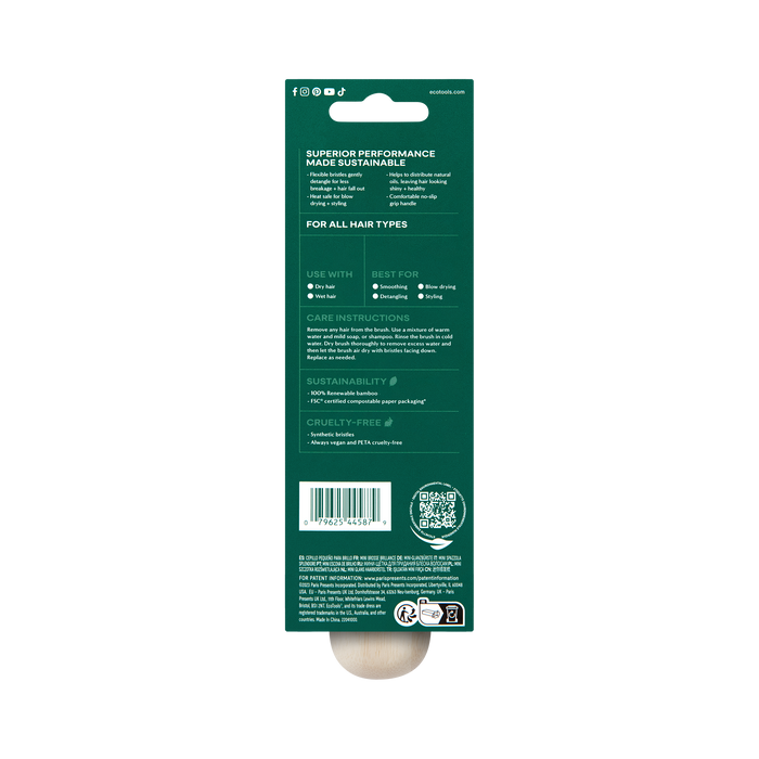 The back of the EcoTools Eco Mini Shine Brush dark green packaging highlights eco-friendly attributes, crafted from 100% renewable bamboo. It includes product features, care instructions, sustainability info, a barcode, QR code, and cruelty-free symbols in white text.
