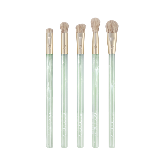 Explore the EcoTools Eco Sea Gems Eye Set, a five-piece brush collection boasting translucent light green handles and soft beige bristles. These cruelty-free, vegan makeup tools are beautifully displayed against a white background.