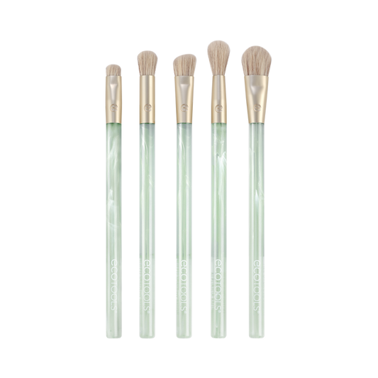 Explore the EcoTools Eco Sea Gems Eye Set, a five-piece brush collection boasting translucent light green handles and soft beige bristles. These cruelty-free, vegan makeup tools are beautifully displayed against a white background.