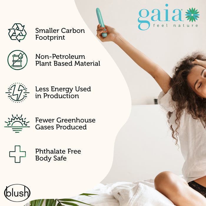 A woman sits on a bed with a relaxed expression, holding a teal item. Text on the left lists eco-friendly features: smaller carbon footprint, non-petroleum plant-based material, less energy use, fewer greenhouse gases, and phthalate-free body safety.