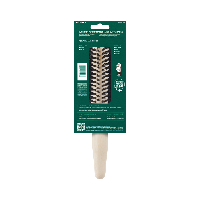 The EcoTools Eco Volumizing Round Brush is a wooden hairbrush crafted from 100% renewable bamboo, featuring vegan boar bristles. It comes packaged on a green cardboard backing with text descriptions and usage instructions.