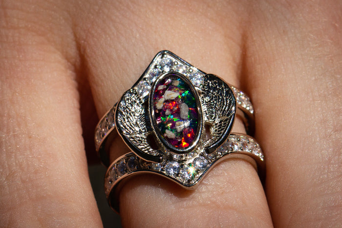 Sterling Silver Embraced Opal Angel Wings Ring, with turquoise and magenta crushed opal, worn by model. Sterling Silver Jewelry for Ash, Sterling Silver Ring, Sterling Silver Angel Wing, Angel Jewelry, Angel Jewlery for Ash, Ring for Remembrance, Memorial Jewelry