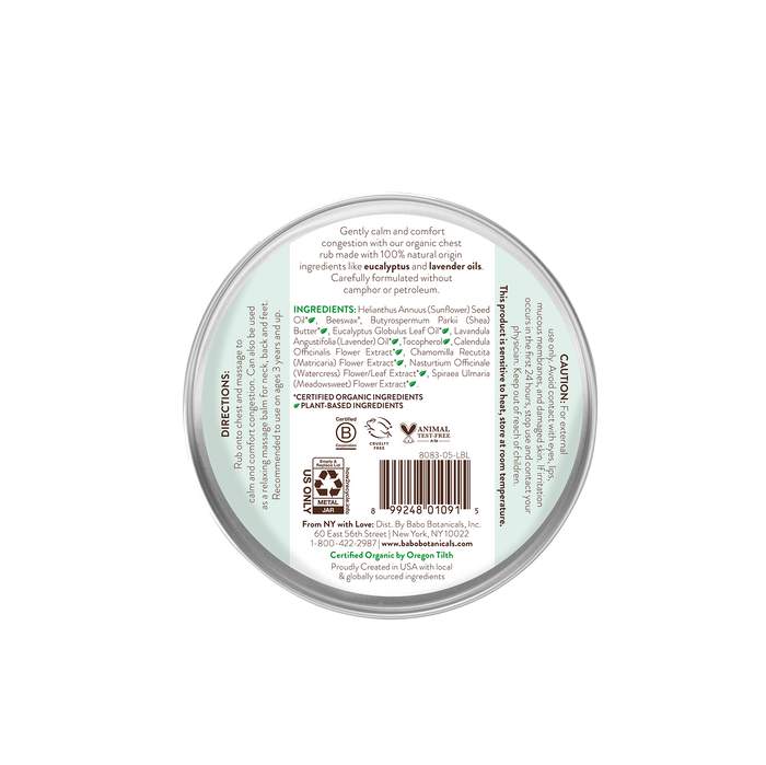 The image shows the back of a round container for Babo Botanicals Eucalyptus Remedy Organic Soothing Chest Rub, listing ingredients and directions. Certified organic by Oregon Tilth, it uses plant-based components. Cautionary details and contact information are also visible.