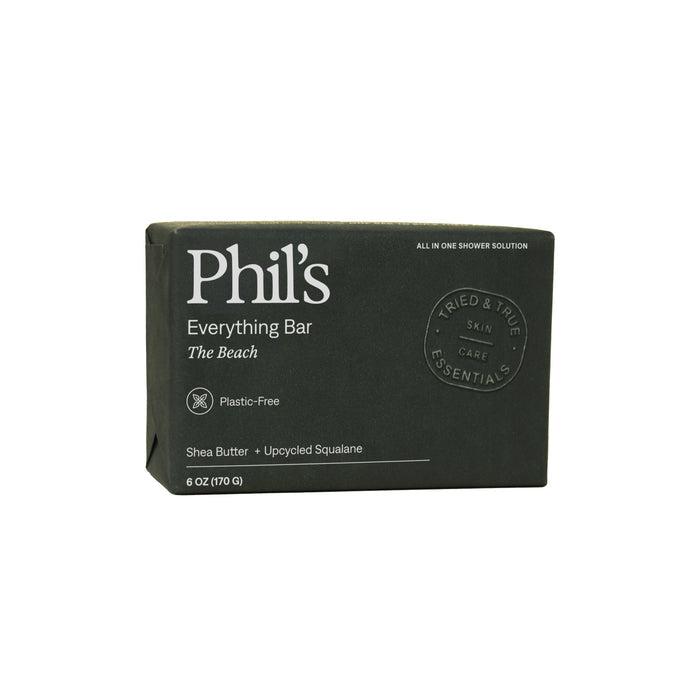 A dark green box labeled Phil’s Everything Bar The Beach highlights it’s plastic-free and features shea butter, chia seed oil, and upcycled plant squalane. This shampoo bar by Phil's weighs 6 oz (170 g).