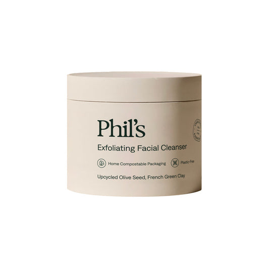Phil's Exfoliating Facial Cleanser comes in a beige, home compostable, plastic-free container and features upcycled olive seed, rice bran, and French green clay for gentle exfoliation.