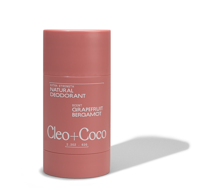 A pink cylindrical stick of Cleo & Coco Extra Strength Deodorant, labeled Grapefruit Bergamot, 2.2 oz (62g), offers powerful aluminum-free odor protection and is shown against a white background.