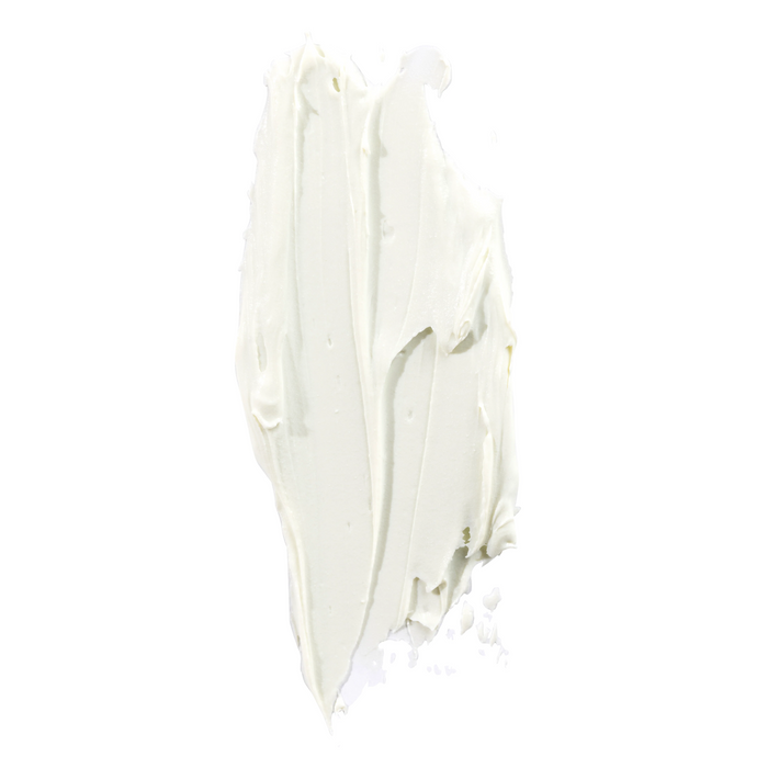 A thick, smooth layer of Raw Elements Face + Body - SPF 30 sunscreen is smeared on a plain white background, emphasizing its broad spectrum protection.