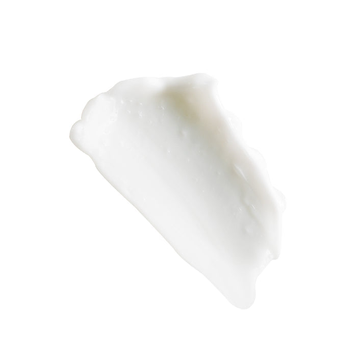 A creamy white smear of Mad Hippies Face Cream is shown against a white background, highlighting its smooth texture with subtle ridges and glossy finish. Enriched with anti-aging peptides, it promotes youthful vitality.