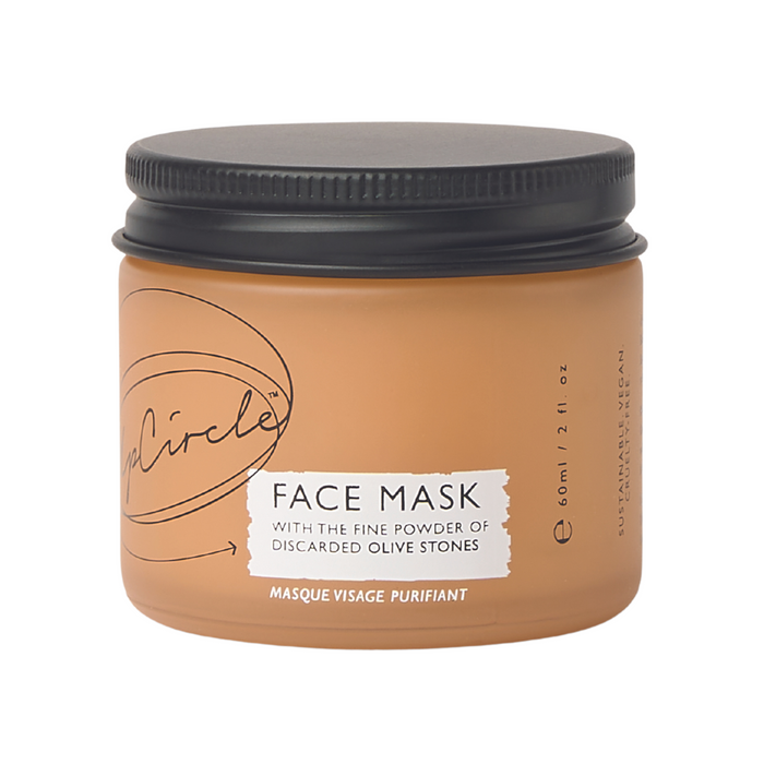 The UpCircle Face Mask with Kaolin Clay comes in a 60ml or 2 fl. oz jar with a black lid and is labeled to highlight its vegan, sustainable ingredients, including kaolin clay and fine powder from discarded olive stones.