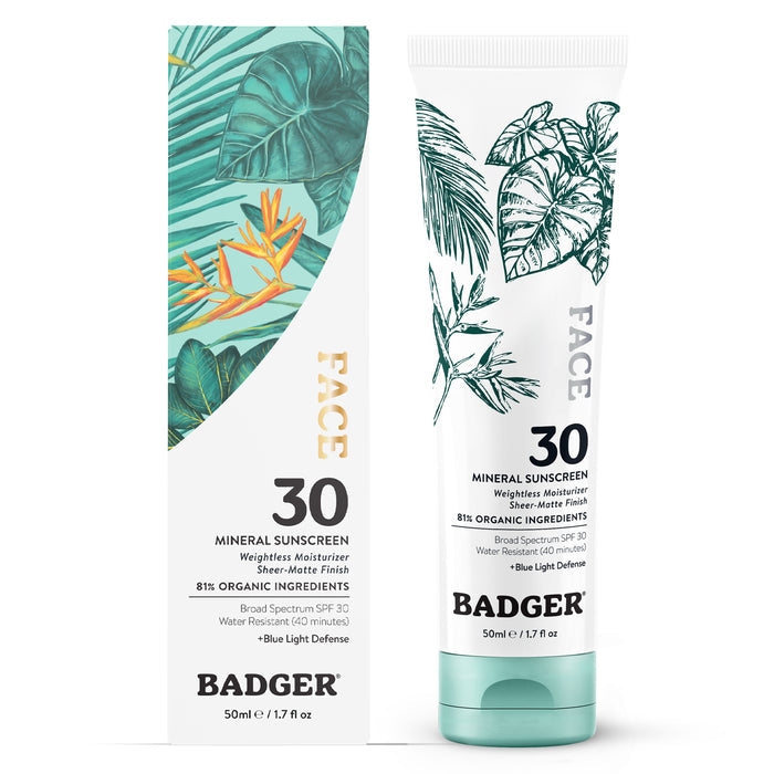 A 50ml tube and box of Badger Balm Face Mineral Sunscreen - SPF 30, with botanical art and green accents; this waterless, blue light defending facial moisturizer contains 81% organic ingredients.