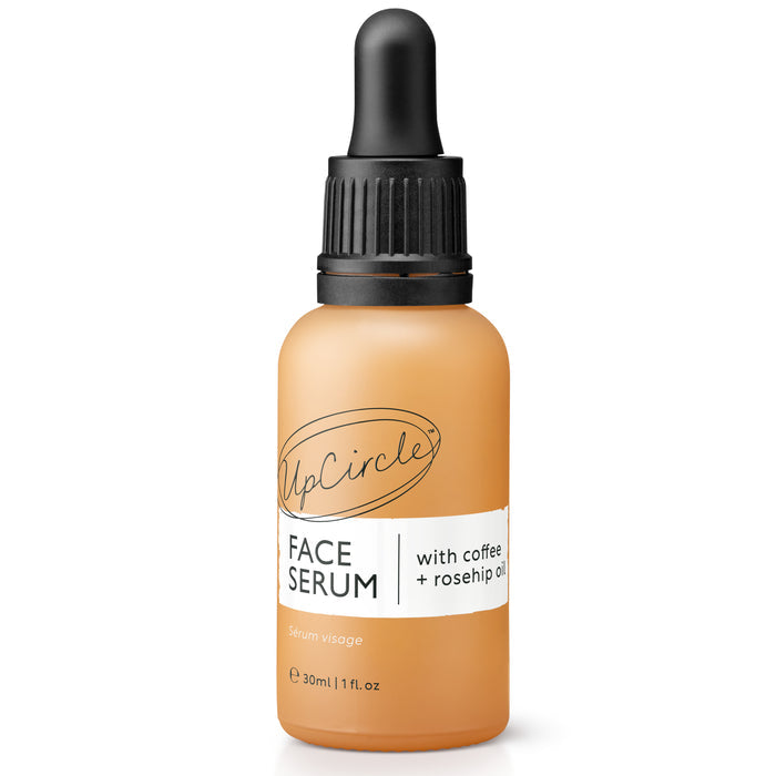 A 30 ml brown bottle of UpCircle Face Oil with Coffee, Rosehip + Jojoba features a black dropper cap and label highlighting Face Serum with coffee + rosehip oil, boasting enhanced collagen production for an organic experience using natures finest ingredients.