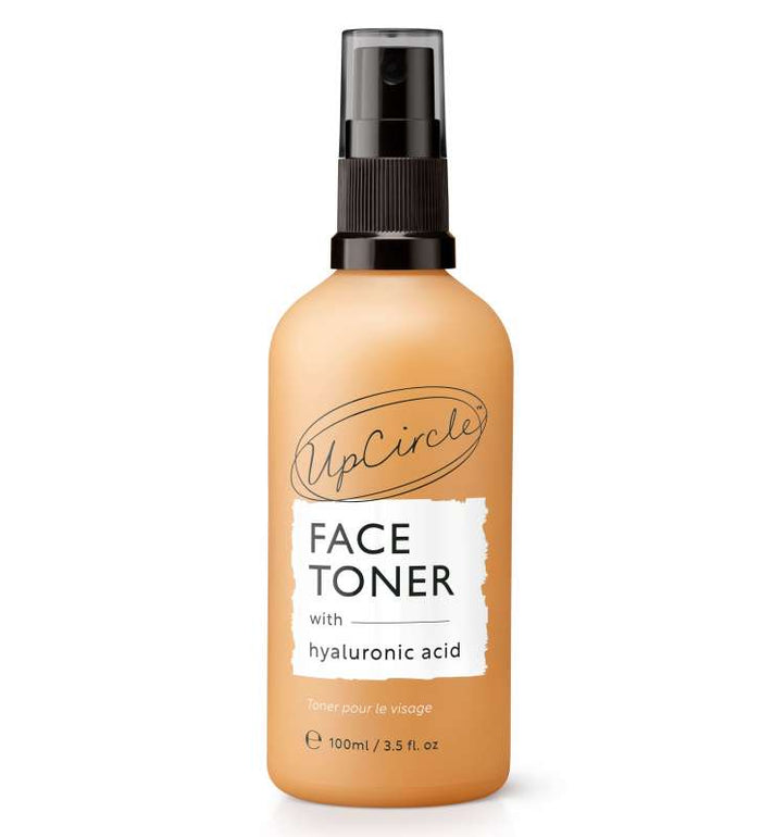 UpCircles Face Toner with Hyaluronic Acid comes in a 100ml light brown bottle with black text and a sleek black spray nozzle, ideal for natural skincare enthusiasts seeking refreshed, glowing skin.