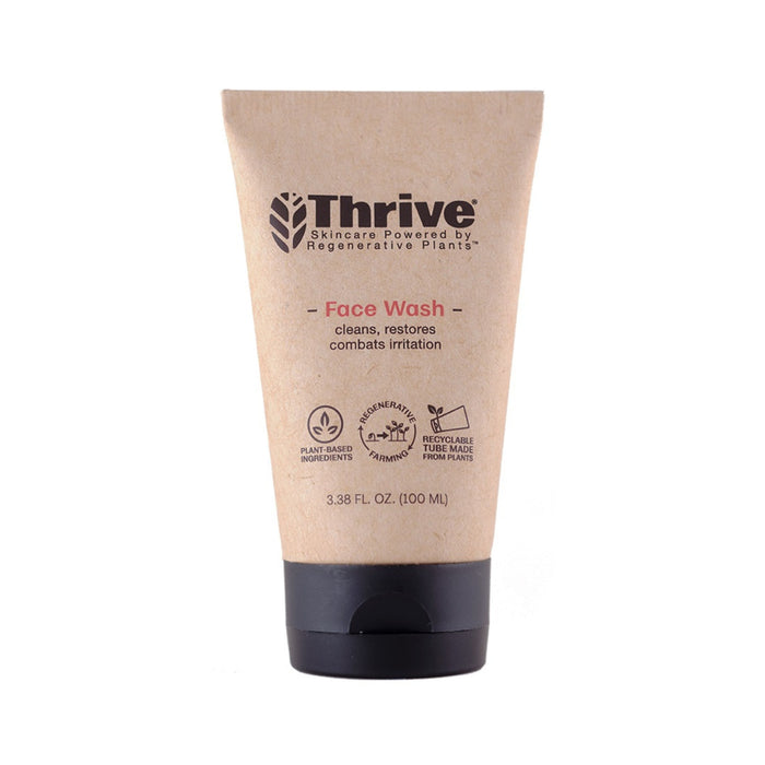 The tan tube of Thrive Natural Care Face Wash, featuring a black cap, has a label that reads Skincare Powered by Regenerative Plants. This gel-based cleanser emphasizes benefits like cleansing, restoring, and soothing irritation with its plant-based formula. Size: 3.38 fl oz (100 ml).
