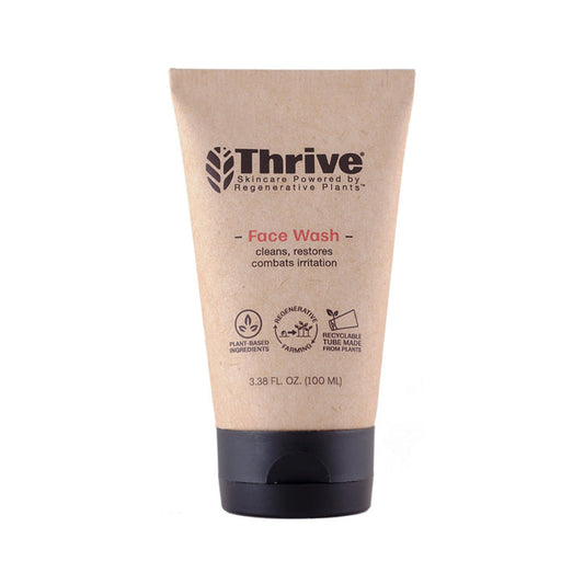 The tan tube of Thrive Natural Care Face Wash, featuring a black cap, has a label that reads Skincare Powered by Regenerative Plants. This gel-based cleanser emphasizes benefits like cleansing, restoring, and soothing irritation with its plant-based formula. Size: 3.38 fl oz (100 ml).