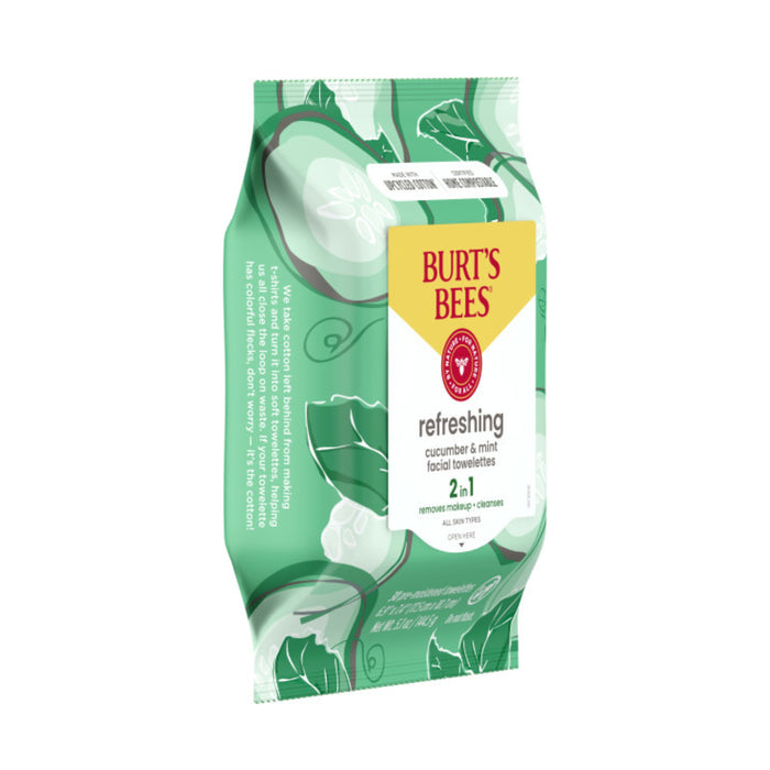 The green pack of Burt’s Bees Facial Cleansing Towelettes - Refreshing, featuring cucumber and mint with leaf and cucumber designs, claims 2 in 1 removes makeup & cleanses and highlights its role as a makeup remover wipe made from 99.1% natural origin ingredients, accompanied by a leaf icon.