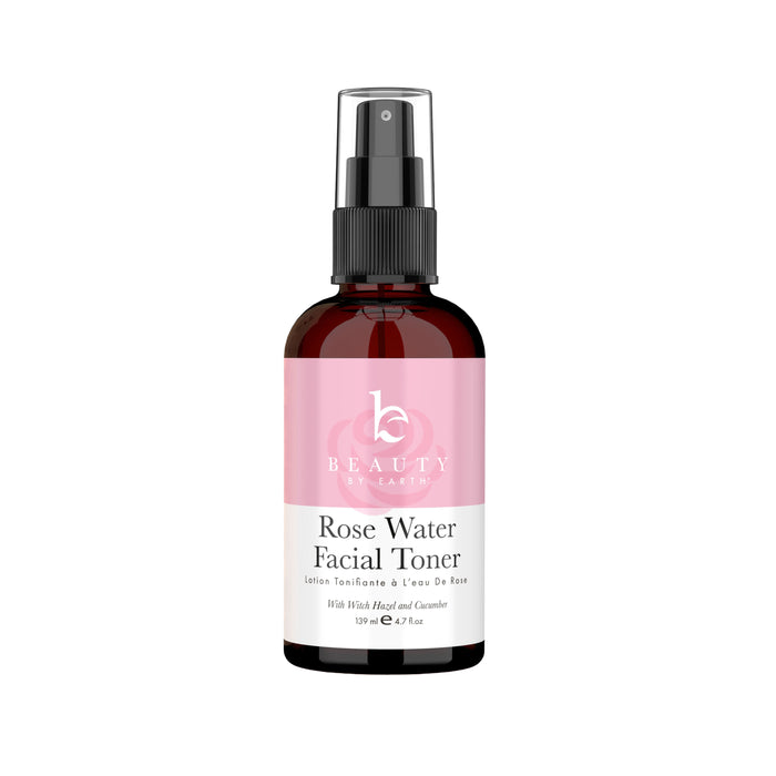 A 118 ml (4 fl oz) bottle of Beauty by Earths Facial Toner, featuring a black spray cap and a pink and white label with the product name in black text, combines refreshing rose petal water and witch hazel.