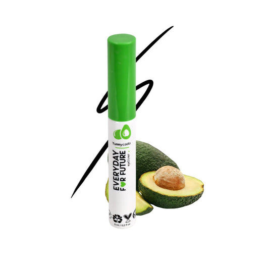 A white Everyday For Future tube with a green cap labeled Felt Tip Avocado Eyeliner is beside a halved avocado, embodying vegan, cruelty-free beauty. A black abstract line on the white backdrop highlights simplicity and elegance.