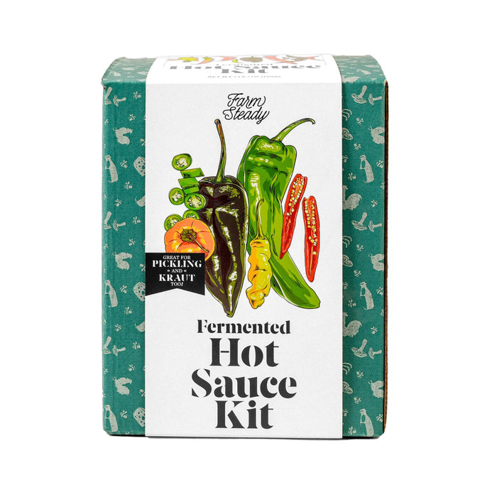 A green FarmSteady box labeled Fermented Hot Sauce Kit features a colorful array of peppers from red to yellow chilies. Ideal for making homemade hot sauce with umami richness, the background displays a charming pattern of small, white vegetables.
