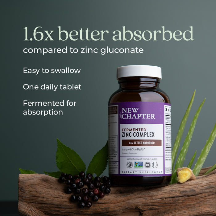 A bottle of New Chapter Fermented Zinc Complex supplement is displayed. Text highlights benefits: "1.6x better absorbed compared to zinc gluconate," "Easy to swallow," "One daily tablet," and "Fermented for absorption." Plants are in the background.