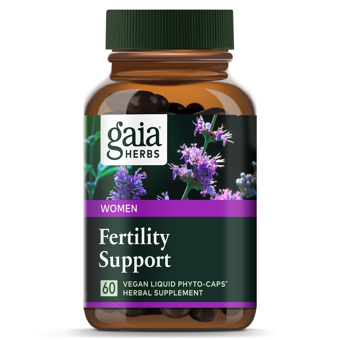 A Gaia Herbs Fertility Support brown bottle with purple flowers on a black background contains 60 vegan liquid phyto-caps, designed to support hormone levels and nurture natural ovulation rhythm.