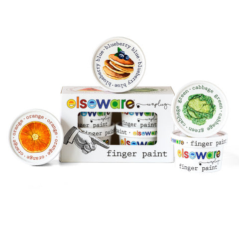 Introducing the eco-kids Finger Paint Set, all-natural and food-safe, with vibrant lids featuring images of oranges, blueberries with pancakes, and broccoli. Enjoy creative fun with peace of mind. Packaging includes the brand name and a pointing hand illustration.