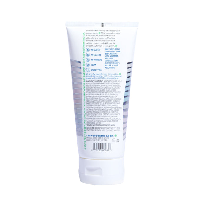 The image depicts the back of a white tube of Firming Body Cream by The Seaweed Bath Co, featuring hyaluronic acid. The label emphasizes no gluten, no sulfates, vegan, and cruelty-free benefits. Directions and ingredients are in small text with a website URL at the bottom.
