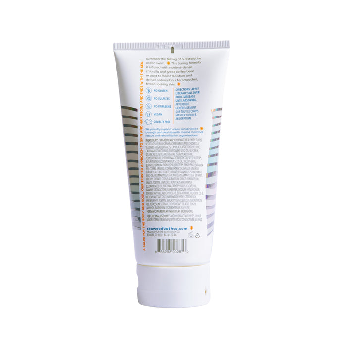 The Seaweed Bath Cos Firming Body Cream comes in a white tube with orange and blue accents. It boasts a detox firming formula with bladderwrack seaweed and hyaluronic acid. The website URL is neatly placed on the bottom of the back label.