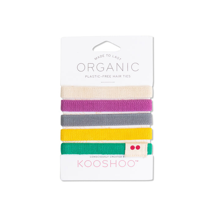 A set of five organic hair ties from KOOSHOO, featuring a variety of colors—beige, purple, gray, yellow, and green—are neatly displayed on a white card. These plastic-free elastics are perfect for anyone embracing sustainable fashion with style.