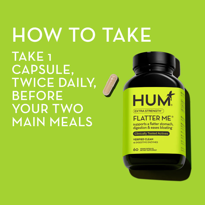 Image of a black bottle on green background labeled "Hum Flatter Me" and a single capsule next to it. White text instructs to "Take 1 capsule, twice daily, before your two main meals." The label mentions digestive enzymes and it contains 60 capsules.