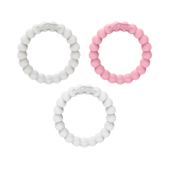 The Fleexees Easy to Hold, 100% Silicone Beaded Teether Rings by Dr. Browns include three circular rings: two white and one pink, featuring evenly spaced rounded beads with the logo embossed on top. The pink ring is placed on the right, while the white ones are on the left and bottom.