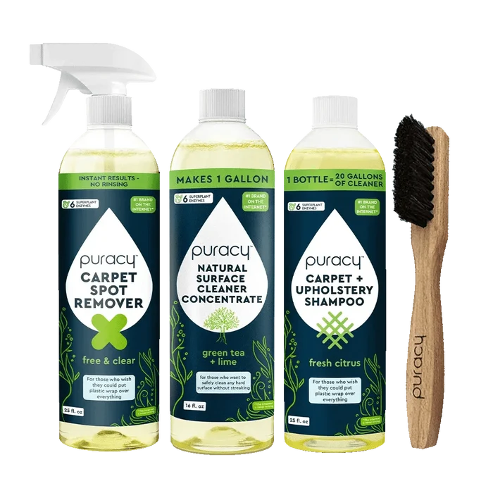 Puracy's Floor & Upholstery Bundle, ideal for furniture and floors, features a spray, two bottles, and a brush set against a green background. This collection ensures your home remains spotless and fresh.