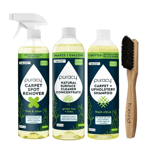 Puracy's Floor & Upholstery Bundle, ideal for furniture and floors, features a spray, two bottles, and a brush set against a green background. This collection ensures your home remains spotless and fresh.