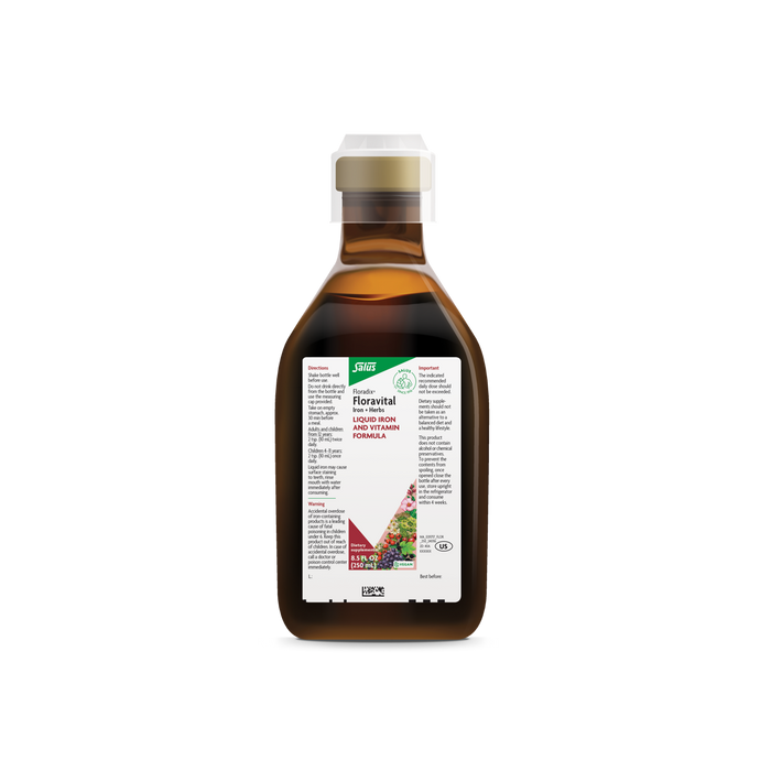 The Floradix Floravital® Iron & Herbs Yeast-Free comes in a brown bottle with an off-white cap. Its white and green label highlights its gluten-free benefits and essential B Vitamins, featuring fruits and vegetables imagery at the bottom.
