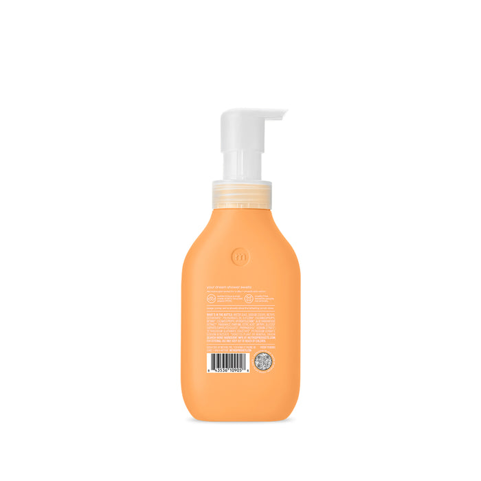 A peach-colored bottle of methods Foaming Body Wash with a white pump, made from recycled plastic, is shown on a plain white background. The back displays text and a barcode.