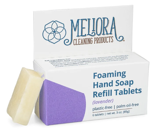 Melioras Foaming Hand Soap Refill Tablets come in a plastic-free box with a white design and purple accents, labeled lavender and palm oil-free. It includes an image of a tablet and contains six refill tablets, with a net weight of 3.0 oz (85g).