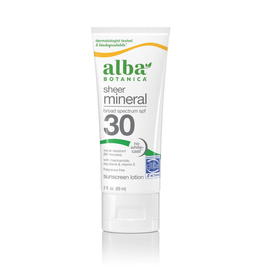 A white tube of Alba Botanica Fragrance Free Sheer Mineral SPF 50 sunscreen features green and orange accents, broad-spectrum protection, water resistance, fragrance-free labeling, and niacinamide.
